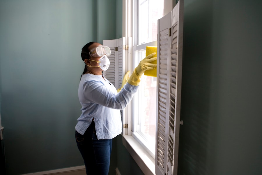 Professional cleaner wiping a commercial workspace surface